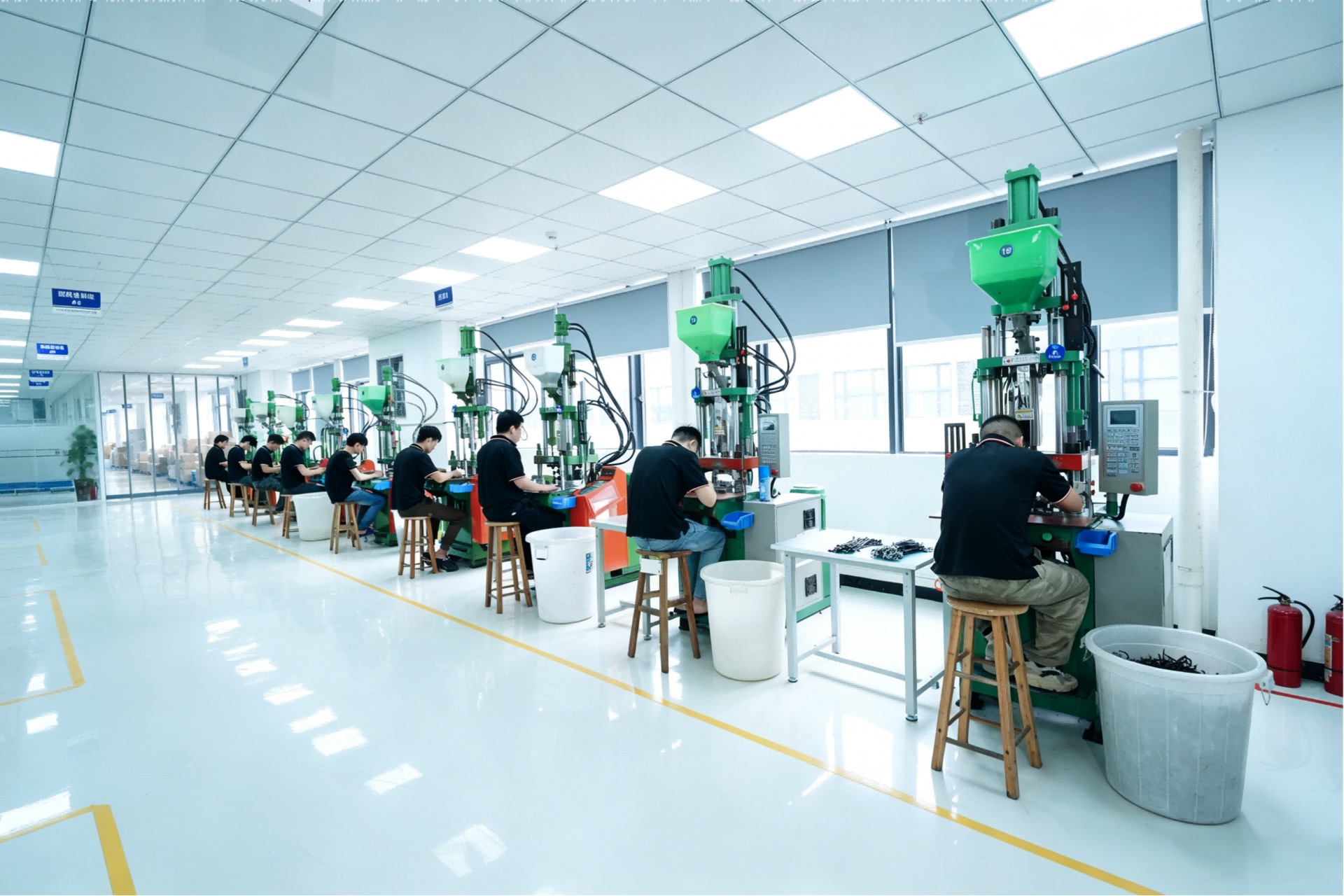 Row of injection-molding machines at the Weisi factory
